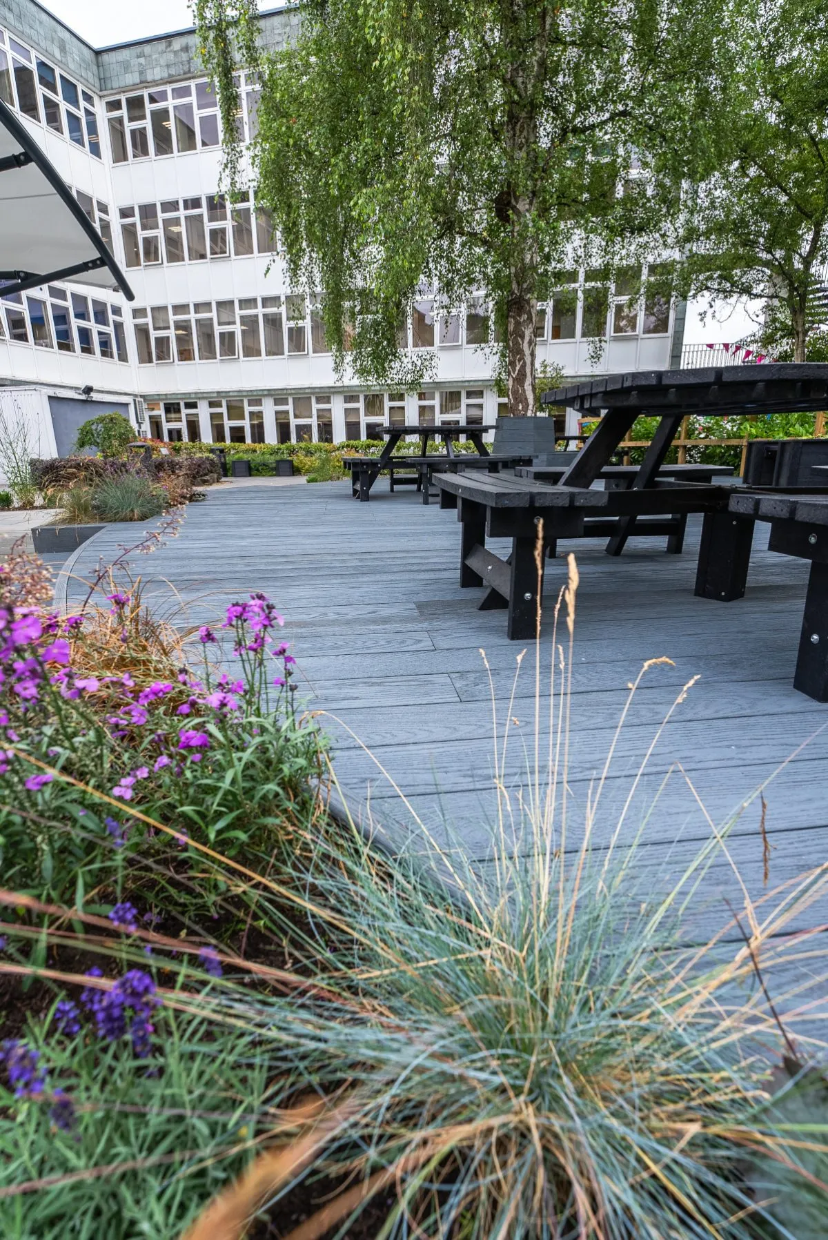 Redux blue dusk panels in commercial garden - Composite Prime