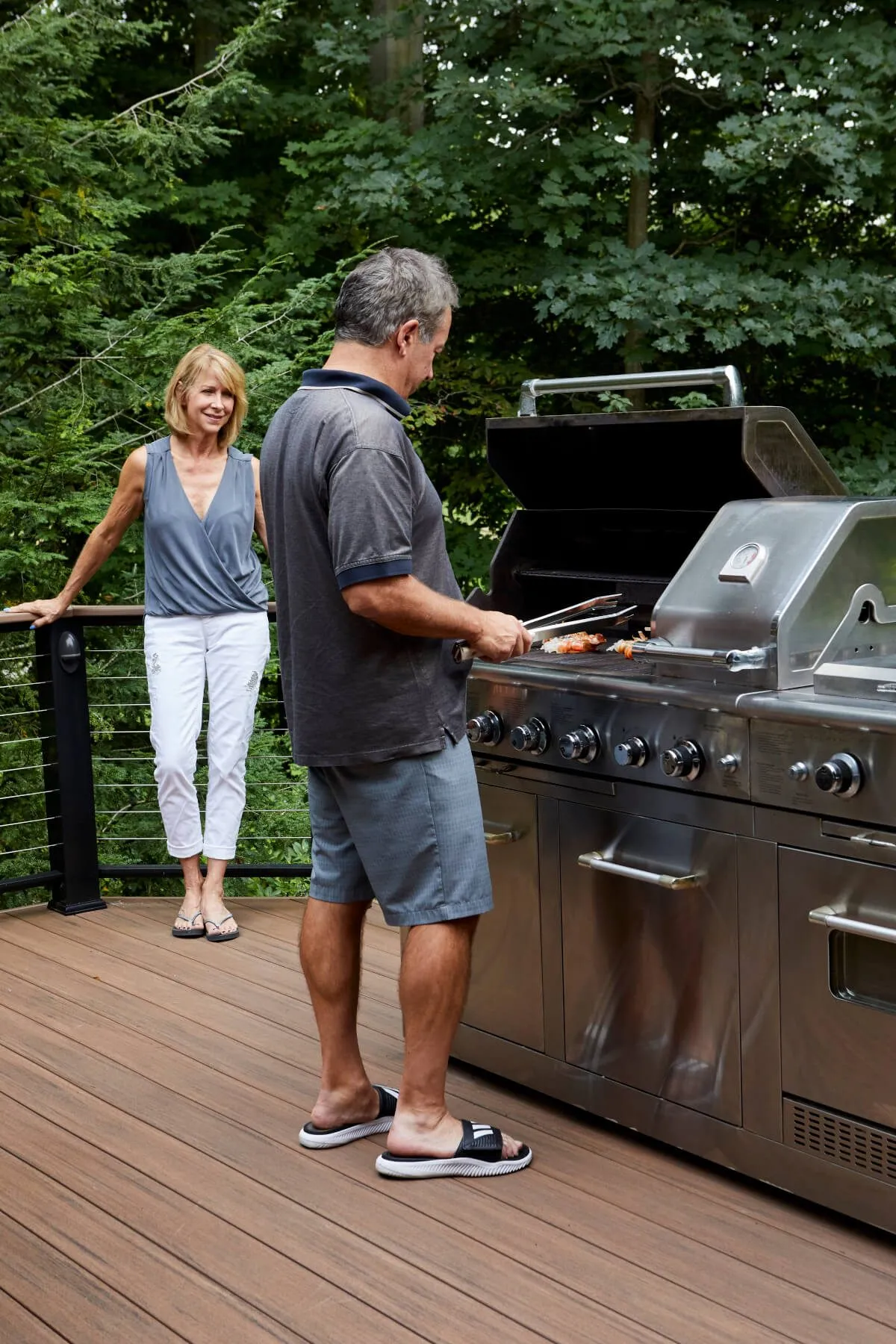 patio area with bbq using elements in shade english walnut - Composite Prime