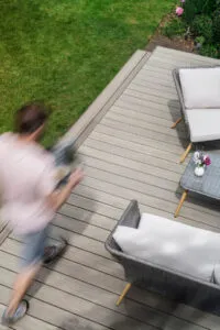 a patio made with composite boards in weathered oak - Composite Prime